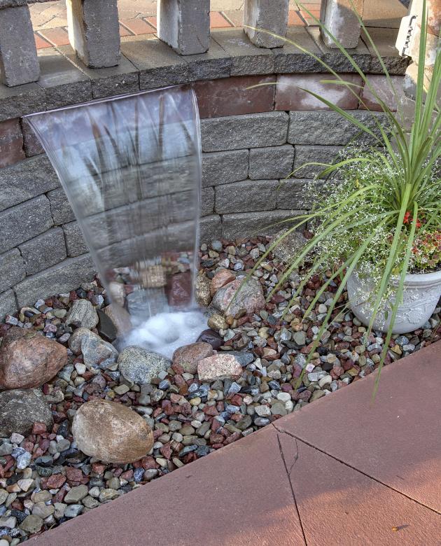 Architecural Photo of a landscaped patio area.